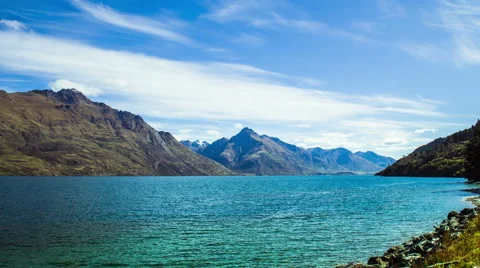 Time Lapse - Clouds Moving Over Lake and Mountain Ranges Stock Footage 58629899