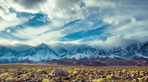 Time Lapse - Clouds Moving Over Snowy Mountain Ranges 库存影片 60968425