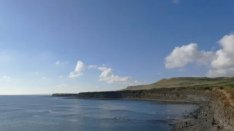 Time lapse of clouds moving over cliffs Stock Footage 70612425