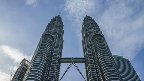 Time lapse of clouds moving over KLCC twin tower. Stock Footage 70650714