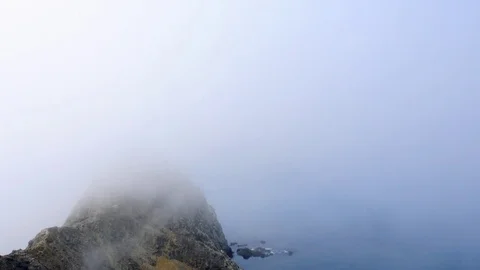 Time-lapse  of clouds moving  over the crest of one of the channel islands  Stock Footage 73217953