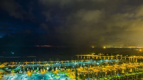 Time Lapse - Clouds Moving Over in Waikiki Beach Harbor at Night Stock Footage 74247012