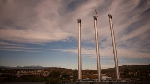 Time-lapse of clouds moving over three columns and the town at sunset Stock Footage 87477139