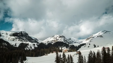 Time lapse of clouds moving over a mountain hill during winter Video stock 87751973