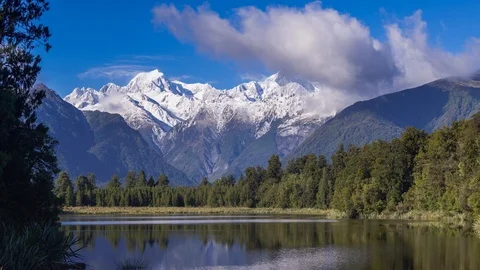 Time lapse of clouds moving over Mount. Cook and Mount. Tasman Stock Footage 90243696
