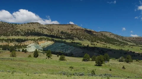 Time-lapse of clouds moving over mountain valley Stock Footage 91179177