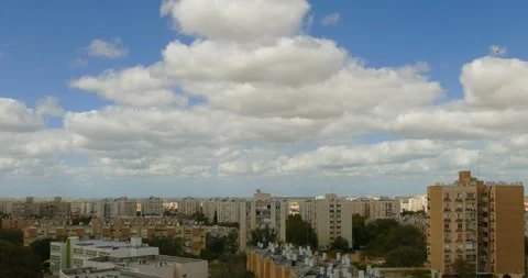 Time-lapse clouds moving over a simple city neighborhood Stock-Footage 92347286