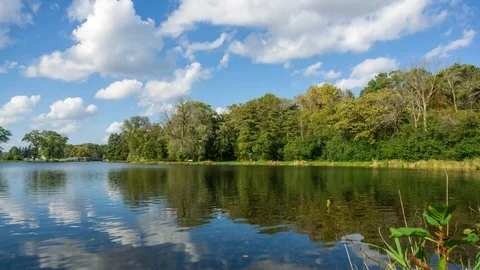 Time lapse of clouds moving over a lake In Wisconsin Stock Footage 98800574