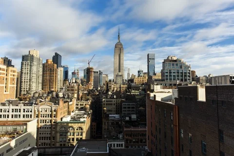 Time-lapse of clouds moving over the skyscrapers in New York Stock Footage 105411644