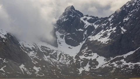 Time lapse of clouds moving over a mountain in Lofoten Stock Footage 112720669
