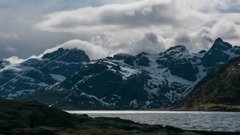 Time lapse of clouds moving over a lake in Lofoten Stock Footage 112720683