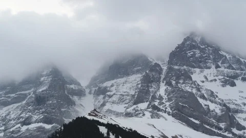 Time-lapse of clouds moving over the beautiful snow covered Alps in winter Stock Footage 113238518
