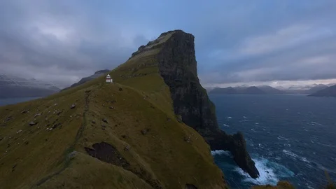 Time-lapse of clouds moving over beautiful rocky cliff and ocean at dusk Stock Footage 116599992