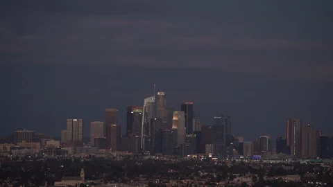 Time-lapse of clouds moving over skyline in the Los Angeles city at night Stock Footage 116600636