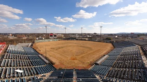 Time-lapse of clouds moving over baseball stadium on a sunny day Stock Footage 116600891