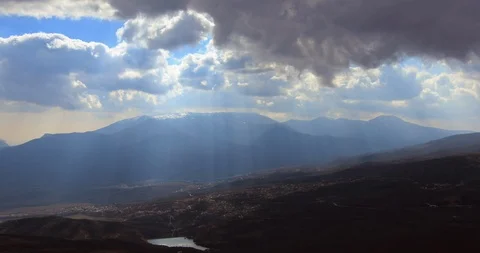 Time lapse of clouds moving over mountain valley. Shooting against the sun Stock Footage 116713909