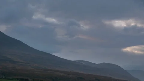 Time Lapse of Clouds Moving Over a Valley at Sunrise Stock Footage 126221352