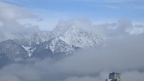 Time lapse clouds moving over small town Kranj in Slovenia Stock Footage 141714870