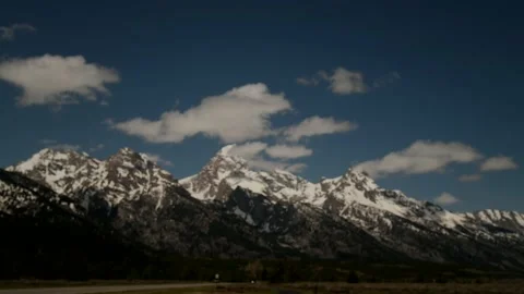 Time lapse of clouds moving over the Teton mountains Stock-Footage 170196192