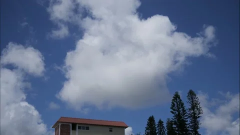 Time Lapse Clouds Moving Over Condo Rooftop Stock Footage 200850233