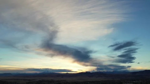 A time-lapse of clouds moving over a valley Stock Footage 297477922