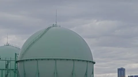 Time-lapse of Clouds Moving Over Spherical Gas Storage Tank in Japan Stock Footage 333416336