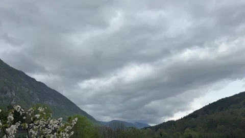 Time lapse of clouds moving over green mountains landscape Stock Footage 333708071