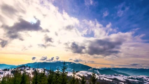 Time lapse of clouds moving over snowy Carpathian mountain peaks Stock Footage 341329352