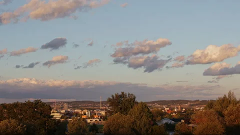 Time-lapse of clouds moving over Ceske Budejovice city at sunset, panoramic.. 스톡 동영상 344885415