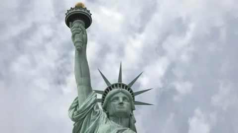 Time lapse of clouds moving past the statue of liberty in New York City. Stock Footage 130351206