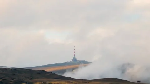 Time lapse of clouds moving past Costila radio relay station Stock Footage 247824567