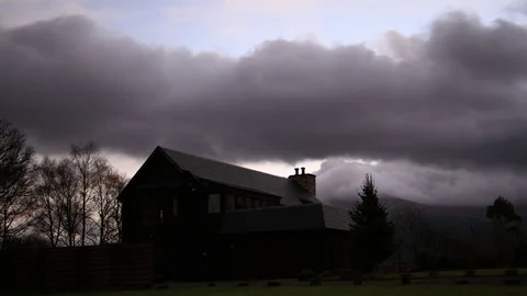 Time Lapse Clouds moving on the Scottish House - Oban Stock Footage 95115466
