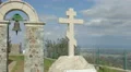 Time lapse of clouds moving in sky over Orthodox stone cross near monastery 4k or 4k+ Resolution