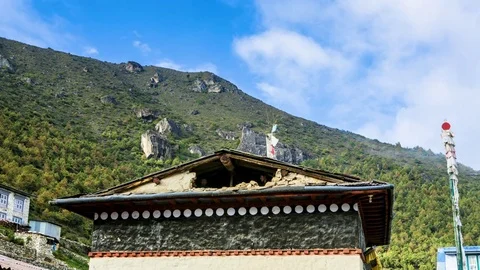Time-lapse of clouds moving in the sky and people on the temple roof Stock Footage 77452218