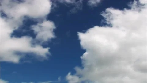 Time lapse clouds moving softly on the sky and the sun shining Stock Footage 280330451