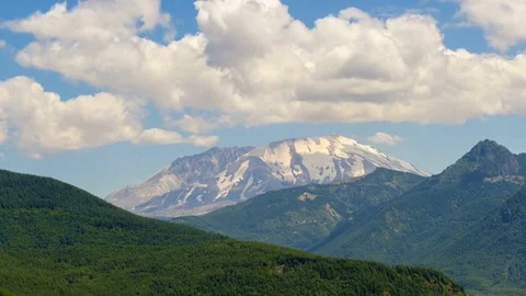 Time lapse of clouds with moving sun shadow over Mount St. Helens closeup 4k uhd Stock Footage 81446524