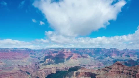 Time-lapse clouds moving at Sunrise in Grand Canyon National Park in Stock Footage 336577784