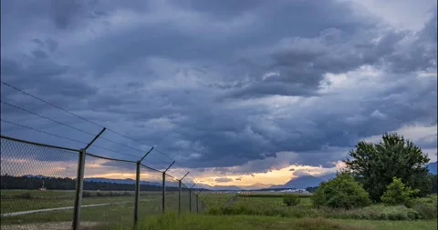Time lapse of clouds moving at sunset Stock Footage 158202396