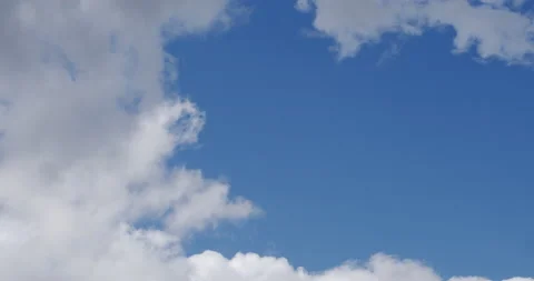 Time lapse of clouds moving through a blue sky with copy space. Stock Footage 132300095