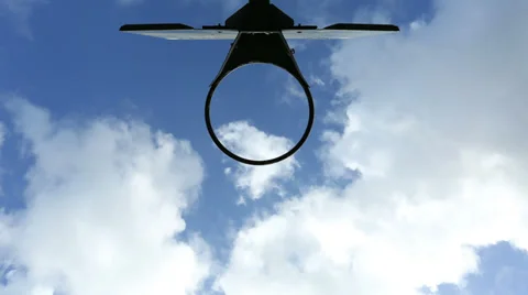 Time lapse of clouds moving viewed from under a basketball hoop Stock-Footage 34130192