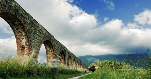 Time-lapse of clouds near the aqueduct and the mountains views in Italy Stock Footage 72874228