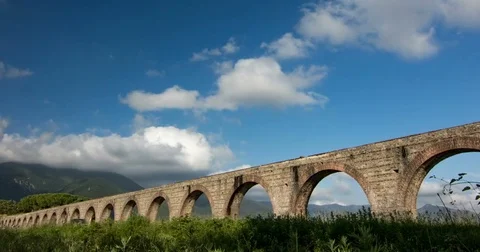 Time-lapse of clouds near the aqueduct and the mountains Stock-Footage 73185644