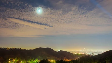 Time Lapse - Clouds at Night with Moon Rising 動画素材 56593955