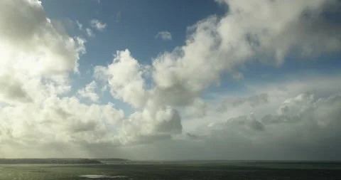 Time Lapse - Clouds obscuring sky and shadowing the sea at the evening. Stock Footage 150593395