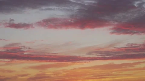 Time Lapse of Clouds in the Orange Red Yellow Blue Evening Sky at Sunset. Stock Footage 135958353