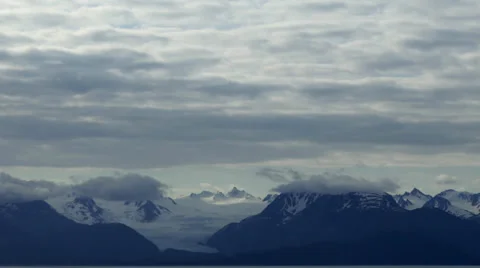 Time lapse: Clouds over Alaskan mountain glacier Stock Footage 39816346