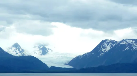 Time lapse: Clouds over Alaskan mountain glacier Stock Footage 39817380