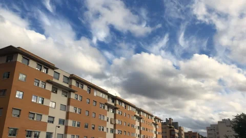 Time lapse of clouds over an apartment residential development Stock Footage 155936620