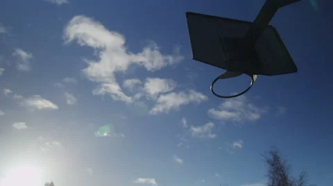 Time lapse of clouds over  basketball court Video stock 46357320