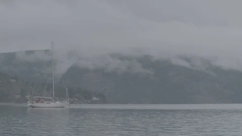 Time lapse of clouds over boat on lake Stock Footage 127120781